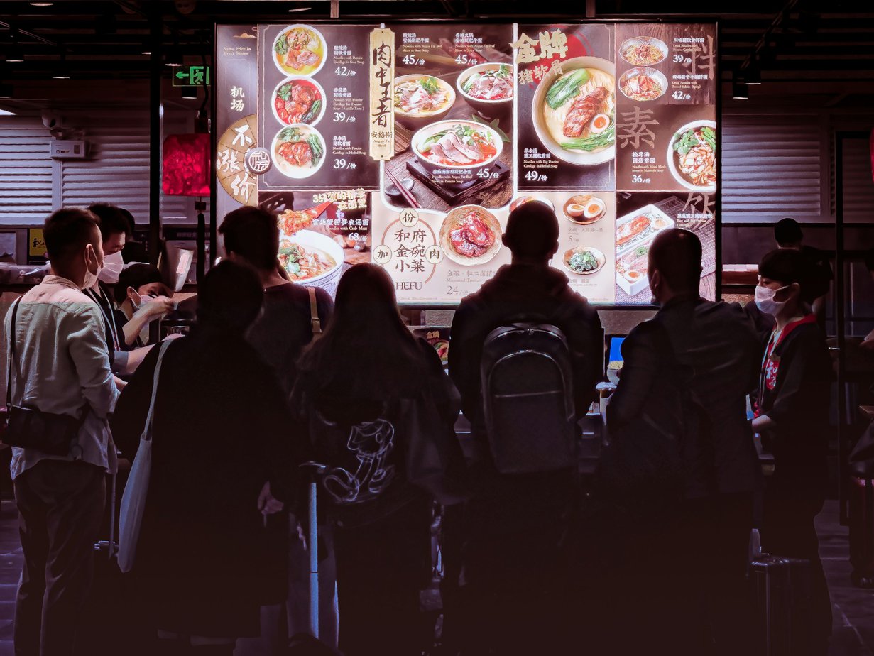 people walking on street during nighttime
